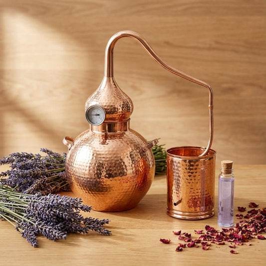 Hand-hammered copper alembic still used for distilling juniper berry oil at home