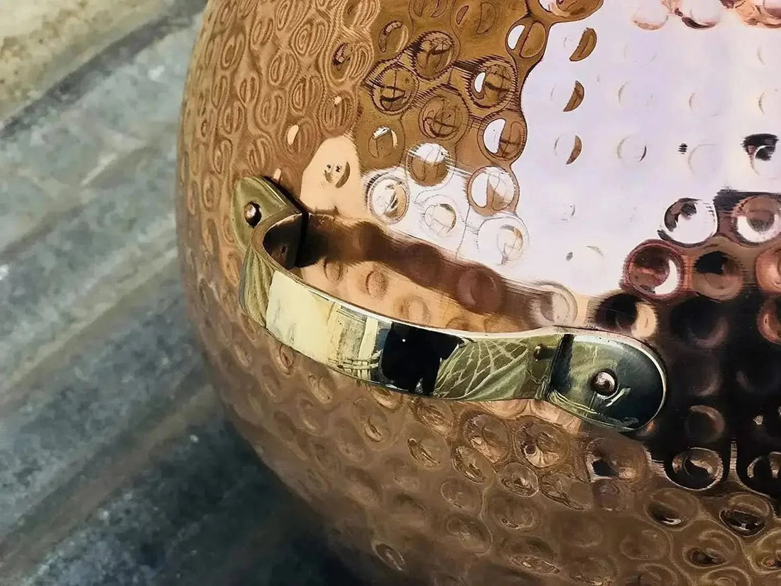 Hand-hammered copper alembic still used for distilling sandalwood at home