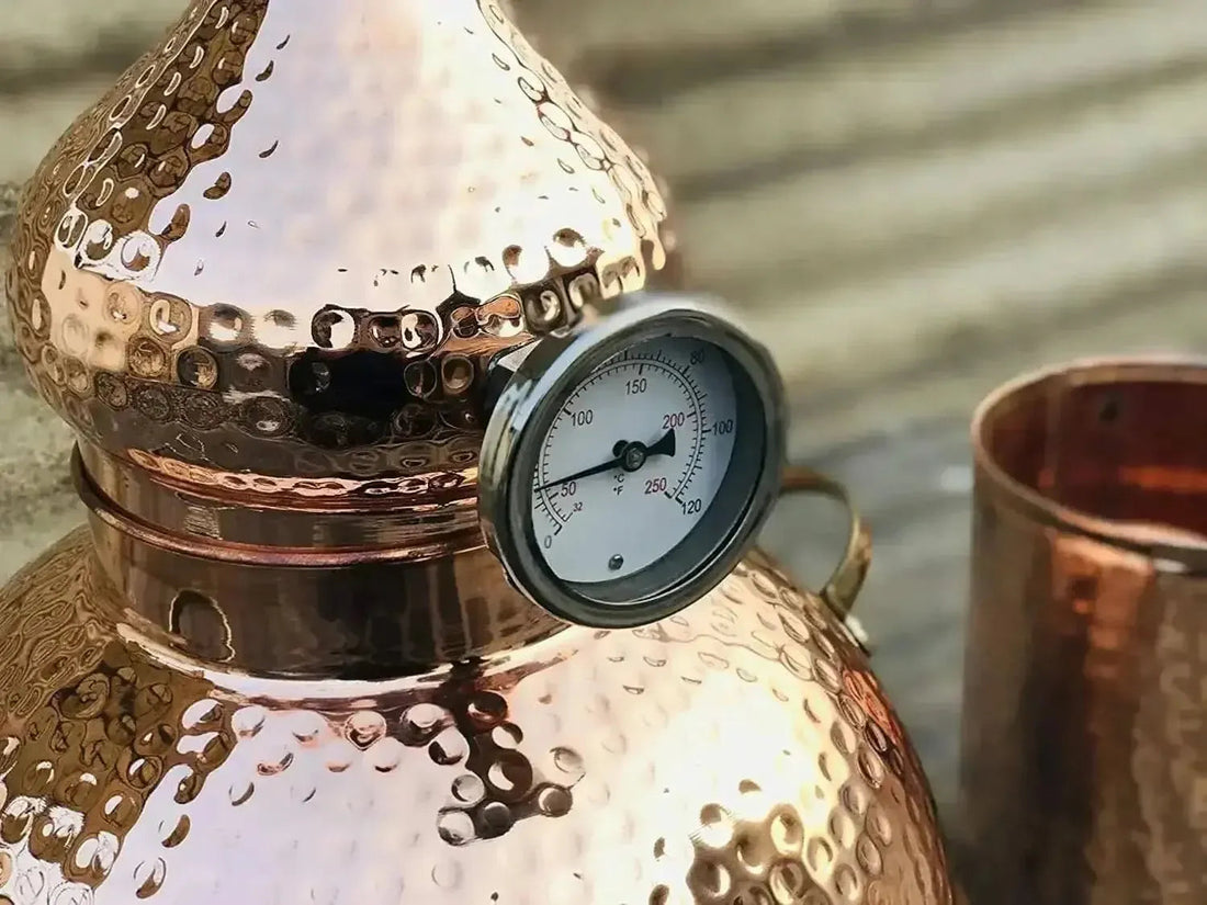 Hand-hammered copper alembic still used for distilling basil water at home