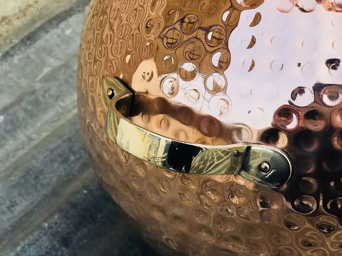 Hand-hammered copper alembic still used for distilling rose geranium at home