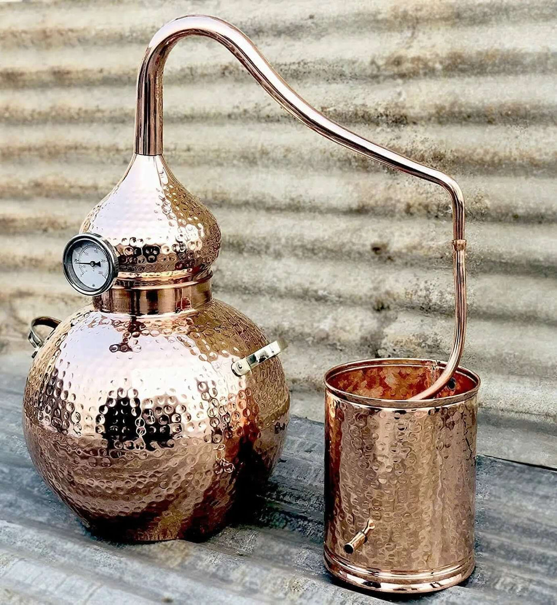 Hand-hammered copper alembic still used for distilling clary sage at home